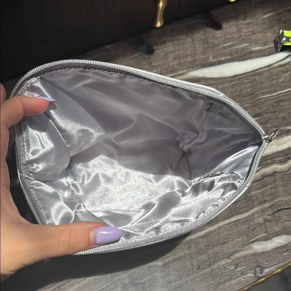 La Prairie Silver Cosmetic Bag with Geometric Design